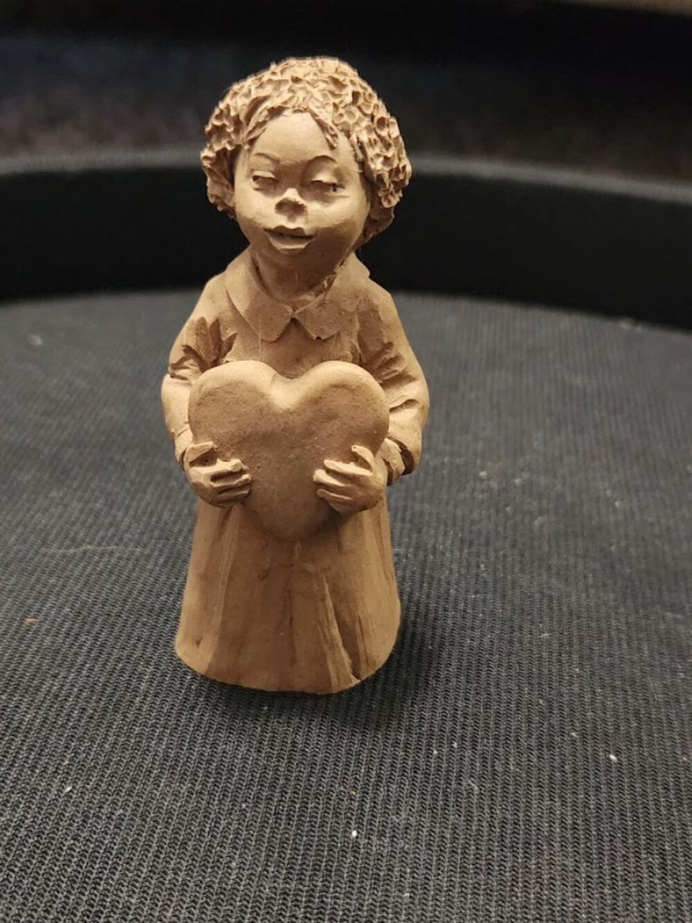"Girl Holding a Heart" from the 1991 TnT folk art series.